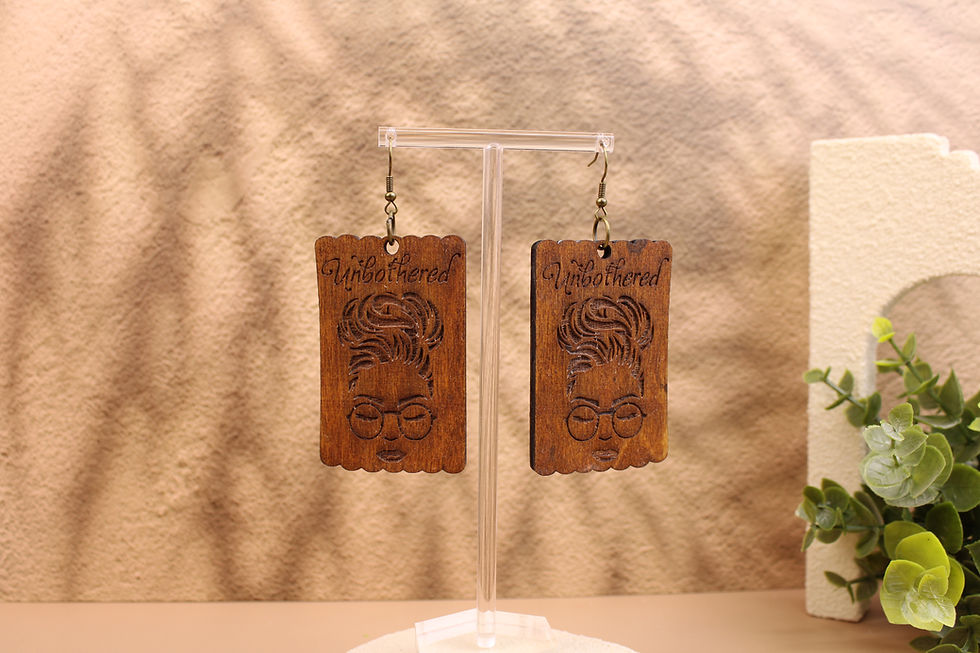 Unbothered Natural Queen wooden earrings with woman's face.