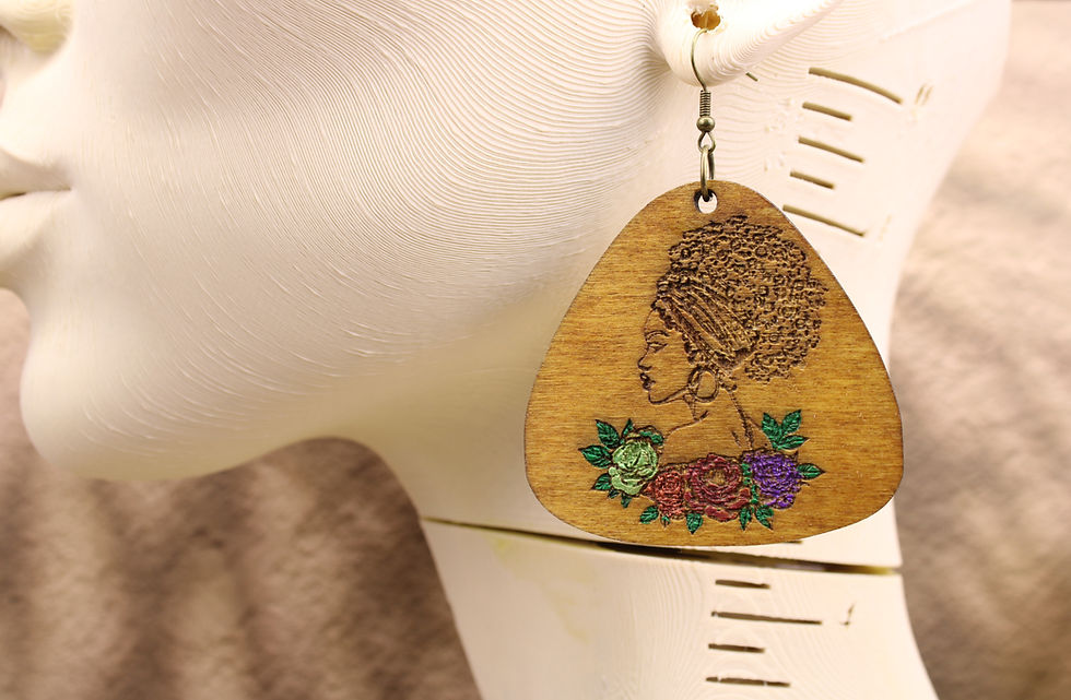 Floral afro silhouette earring on a white mannequin head.