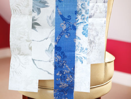 Simon Charles Interiors - sample materials laid over the back of a chair