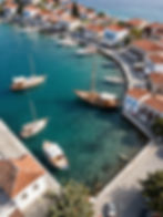 Picturesque harbor with traditional buildings and sailing boats