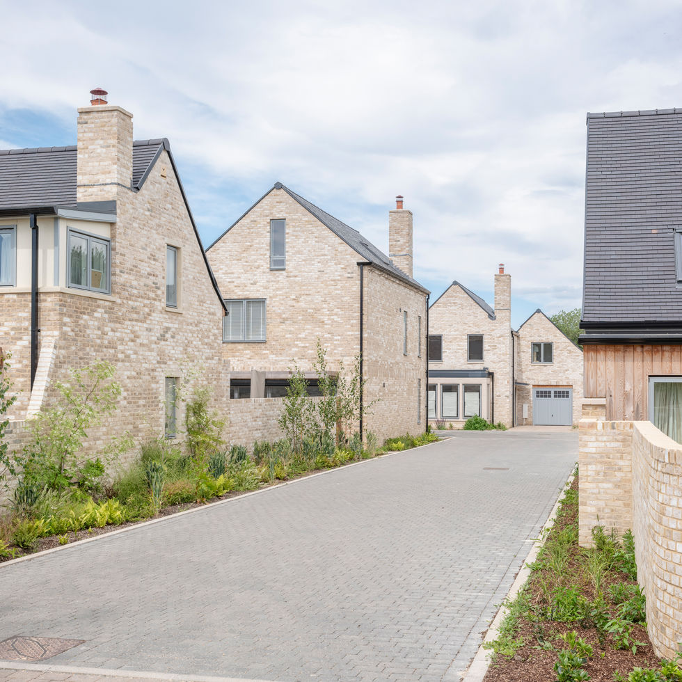 Histon Road housing street view in Cambridge by Haysom Ward Miller Architects — brick homes and planting