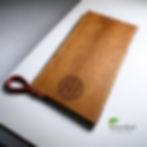 21 INCH CHERRY WOOD CHARCUTERIE BOARD WITH RED LEATHER STRAP HANDLE