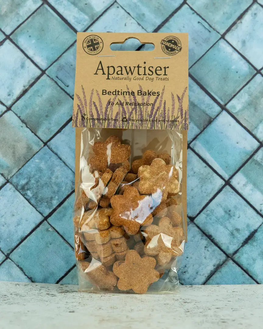 Thumbnail: Bag of natural dog biscuits treats with blue background