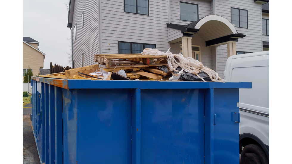 A dumpster overflowing with wood scraps and various debris.