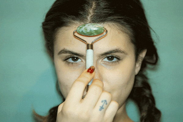 jade-rolling-on-forehead.gif