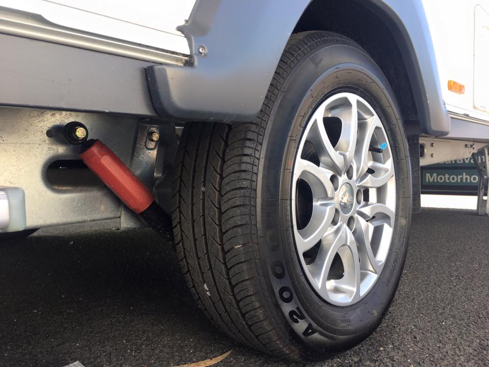Raised single axle chassis with independent suspension, shock absorber and 15 inch wheels.