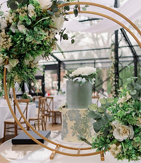 A two tiered sage and cream cake within a flower circle. by sundeis based in purley