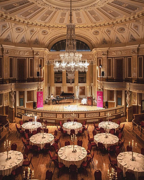 A bird's eye view of Josh playing in St George's Hall for Bordeaux Wine Festival. You can see the whole concert room with Josh centre-stage playing on the grand piano.