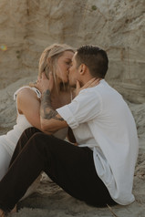 a couple kissing on the beach