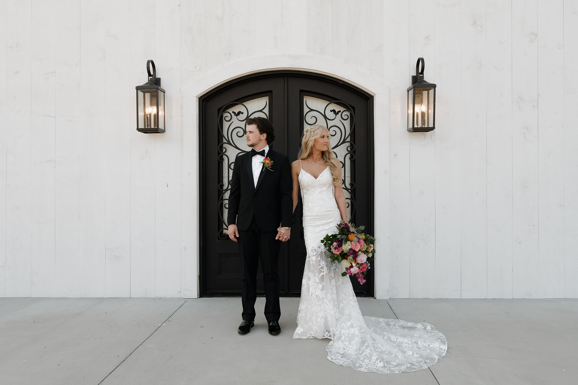 Bride and groom standing side by side