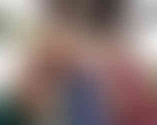 Family members standing side by side for an extended family event.