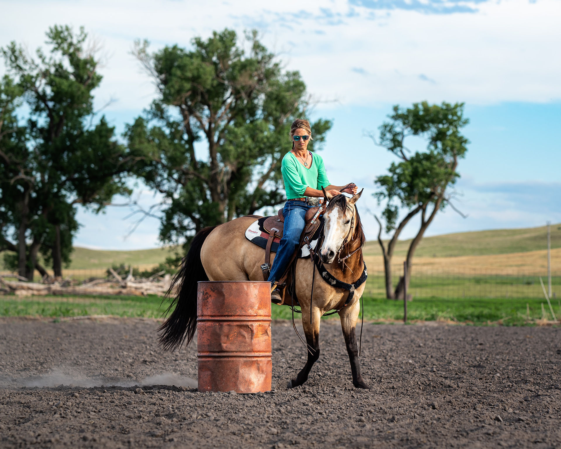 Sam Flannery takes a young colt, Shez Lucky N Smooth, around the barrel during an arena practice.