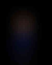 Becca Fellman laughing during her headshot.