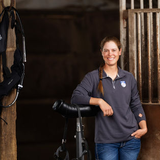 Allison of K Arrow Equine Veterinary Dentistry stands with her floating equipment.