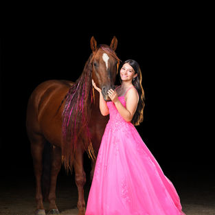Young woman in pink ballgown posing with chestnut reining horse Flint at Spirit Horse Ranch in Gretna, Nebraska