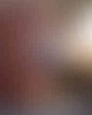 senior girl in jumper leaning on urban wall in Ashland, NE