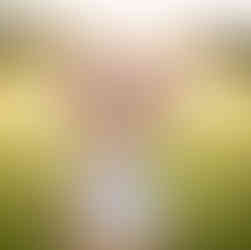 sunshines on toddler girl with pink cowboy hat in grassy field