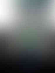 senior boy on track field with marching baritone at Gretna High School