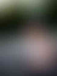 Woman with hobby camera posing for portraits