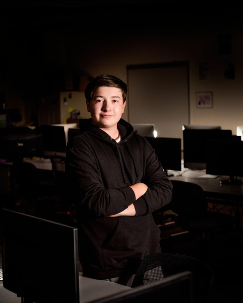 Senior guy in computer lab for Senior Portraits