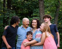 Parents and their children standing and smiling at Platte River State Park. 