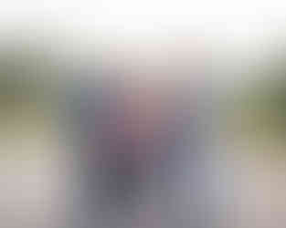 Family members standing side by side for an extended family event.