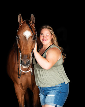High School senior posing with her horse