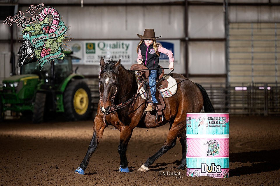 A peewee turns the second barrel riding the Candy Cane Classic in McCook, Nebraska.