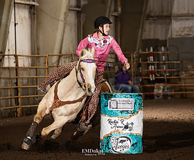 Ruby June Edwards turing a barrel during a barrel race in Broken Bow, NE.
