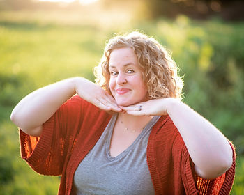 sassy headshot of woman outdoors at golden hour