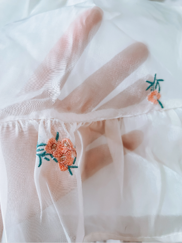 Thumbnail: sheer off white toddler dress close up view of flower embroidery detail
