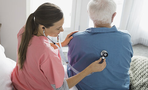Nurse checking patient's back