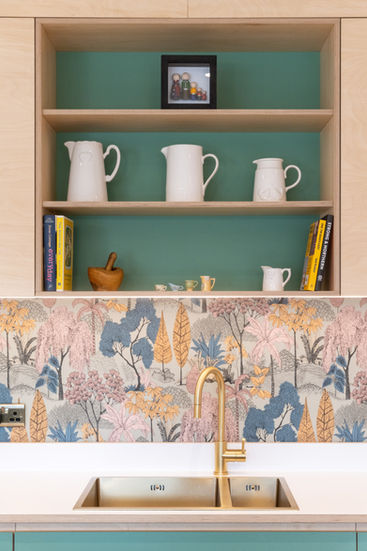 open birch plywood shelves above a sink