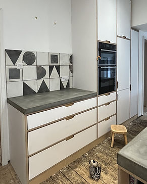 White laminated plywood kitchen with inset doors