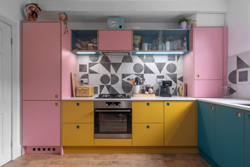 Bespoke plywood kitchen, pink blue and yellow doors