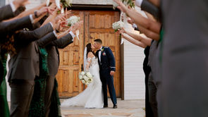 Couple shares kiss in front of bridal party at La Bonne Vie Ranch in  Fredericksburg Texas