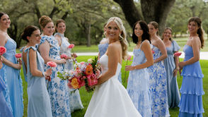 ride and bridesmaids posing and laughing at The Chandelier of Gruene wedding venue in  New Braunfels Texas