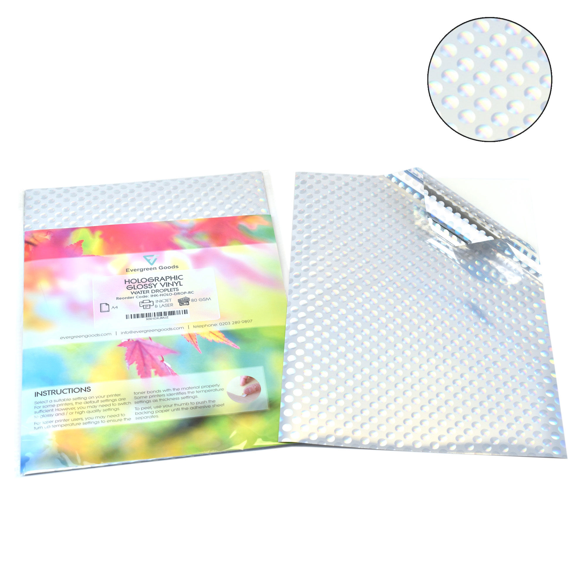 A colorful instructional book next to A4 Holographic Silver Sticker Vinyl Label with droplets design.