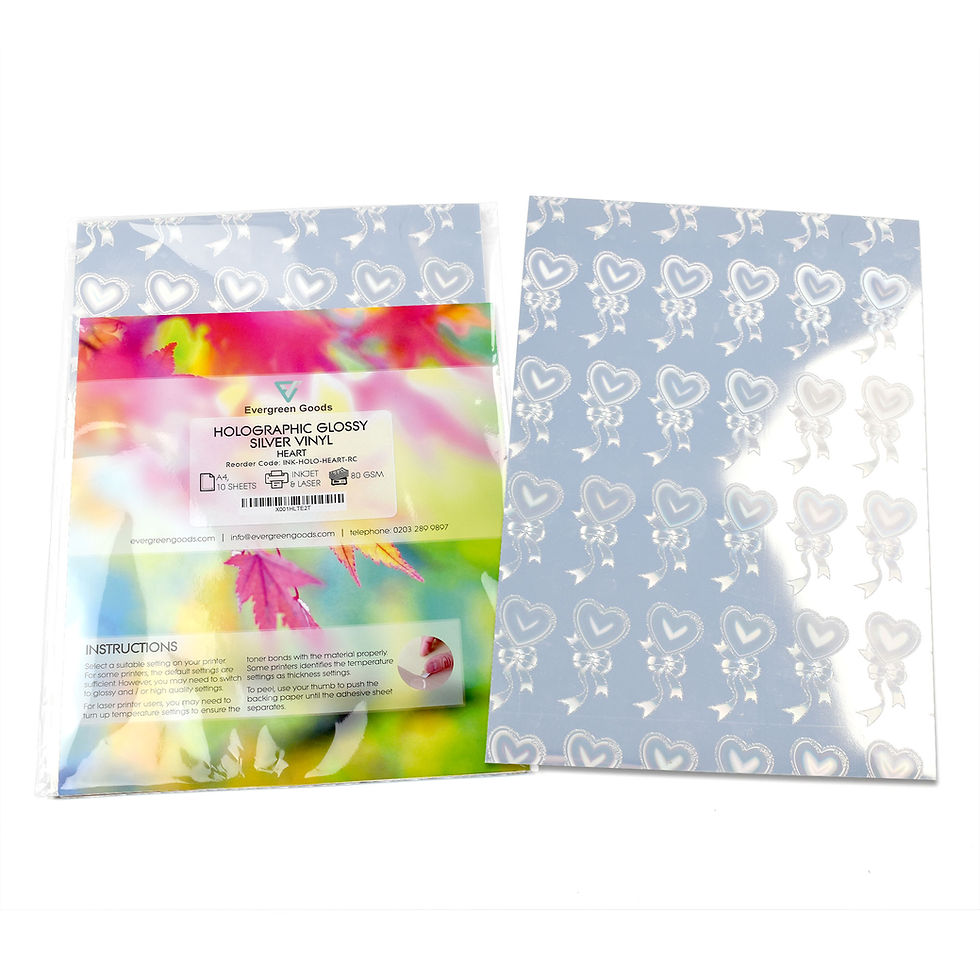 Thumbnail: A colorful instructional book, next to A4 Holographic Silver Sticker Vinyl Label with heart designs.