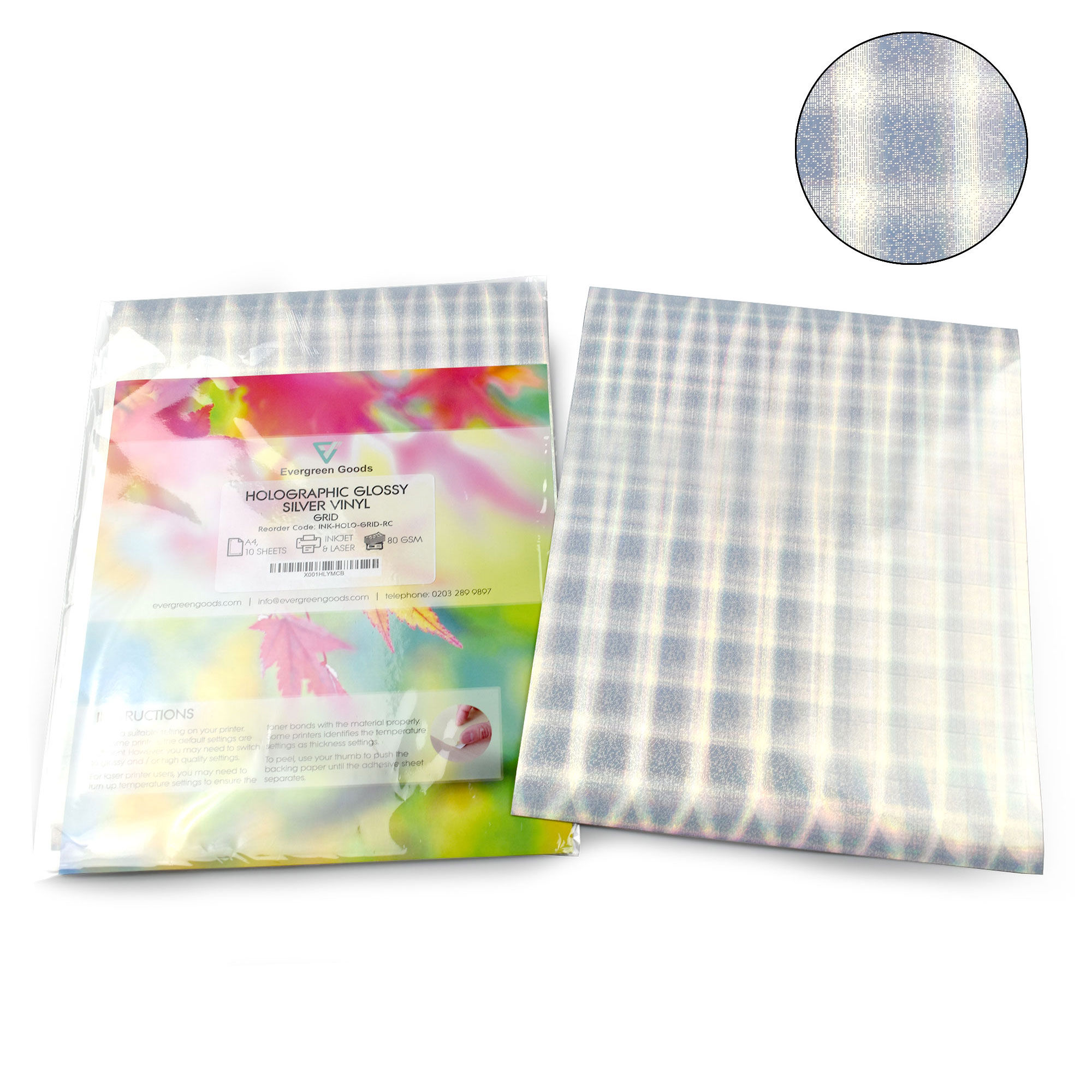 A colorful instructional book, next to A4 Holographic Silver Sticker Vinyl Label with grid design.