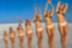 Woman on beach embracing her life