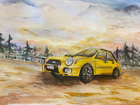 A yellow car sitting in front of a forest