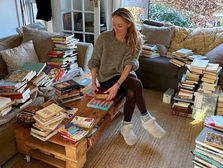 Woman decluttering books