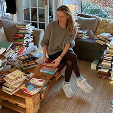 Woman decluttering books