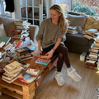 Woman decluttering books