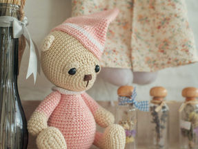 Knitted pink baby toy