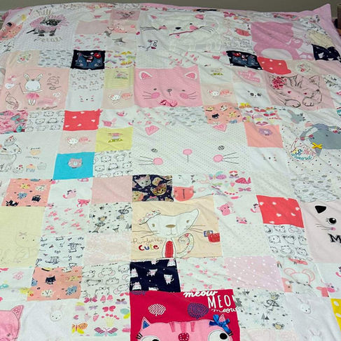Patchwork quilt made from baby clothes