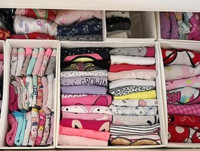 kids clothes folded in a drawer