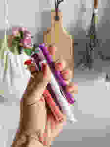 Womens hand hold childrens medicine syringes