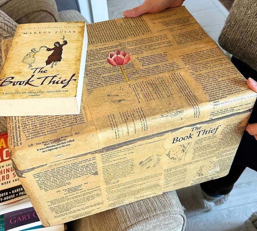 storage box decorated with pages from the novel The Book Thief